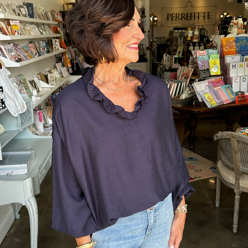 
                      
                        Navy Ruffle Top
                      
                    