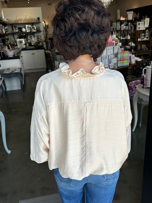 
                      
                        Oatmeal Ruffle Top
                      
                    
